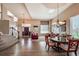 Elegant living space showcasing high ceilings, hardwood floors, a dining area, and a beautiful staircase at 6271 Mcintyre Way, Golden, CO 80403