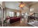 Bright and spacious living room with high ceilings, hardwood floors, and large windows, ideal for relaxation at 6271 Mcintyre Way, Golden, CO 80403