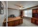 Spacious office with wood trim, built-in shelving, and a comfortable work space at 6271 Mcintyre Way, Golden, CO 80403