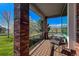Covered porch featuring comfortable seating and a dining table, perfect for enjoying the outdoor views and fresh air at 6271 Mcintyre Way, Golden, CO 80403