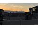 Enjoy backyard mountain views from a wooden playset with neighborhood views in the background at 1160 Acadia Cir, Erie, CO 80516