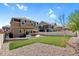 Private backyard with lush grass, gravel beds, and a patio, offering a serene outdoor retreat at 1160 Acadia Cir, Erie, CO 80516