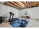 Unfinished basement with exposed ceiling and gym equipment, ready for customization and workouts at 1160 Acadia Cir, Erie, CO 80516