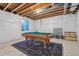 Unfinished basement featuring a pool table, room to customize for recreation and entertainment at 1160 Acadia Cir, Erie, CO 80516