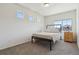 Cozy bedroom with neutral walls, soft carpet, and bright natural light at 1160 Acadia Cir, Erie, CO 80516