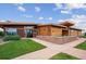 Exterior view of the community clubhouse with modern design and manicured landscaping at 1160 Acadia Cir, Erie, CO 80516