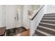 Inviting entryway with staircase, neutral walls, and convenient coat closet at 1160 Acadia Cir, Erie, CO 80516