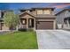 Charming two-story home featuring a well-maintained lawn, covered porch, and a convenient two-car garage in a suburban neighborhood at 1160 Acadia Cir, Erie, CO 80516