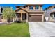 Charming two-story home featuring a well-maintained lawn, covered porch, and a convenient two-car garage in a suburban neighborhood at 1160 Acadia Cir, Erie, CO 80516