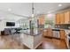 Spacious open-concept kitchen featuring a large island, modern appliances, and seamless flow into the living area, perfect for entertaining at 1160 Acadia Cir, Erie, CO 80516
