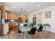 Bright kitchen and dining area featuring modern appliances, hardwood floors, and a stylish dining table, perfect for Gathering meals at 1160 Acadia Cir, Erie, CO 80516