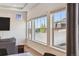 Bright living area with large windows, hardwood floors, and stylish decor, offering a welcoming and airy atmosphere at 1160 Acadia Cir, Erie, CO 80516