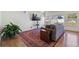 Cozy living room featuring a comfortable sofa, large area rug, and ample natural light, perfect for relaxing and entertaining guests at 1160 Acadia Cir, Erie, CO 80516