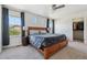 Spacious primary bedroom with large bed, walk-in closet, and multiple windows at 1160 Acadia Cir, Erie, CO 80516