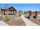 Community park featuring a covered picnic area, playground, and walking paths, perfect for Gathering outings at 1160 Acadia Cir, Erie, CO 80516