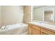 A Primary bathroom offers a soaking tub and vanity at 119 Lake Ave, Palmer Lake, CO 80133