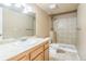 Bright bathroom featuring a shower and vanity with white sink at 119 Lake Ave, Palmer Lake, CO 80133