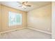 Bedroom featuring carpet and a window with blinds at 119 Lake Ave, Palmer Lake, CO 80133