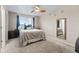 Relaxing bedroom featuring an overhead fan, soft carpet, and natural light from the window at 2005 E 103Rd Ave, Thornton, CO 80229