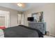 A spacious bedroom includes an open doorway to the en suite bath and a large closet at 2005 E 103Rd Ave, Thornton, CO 80229