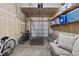 An attached garage with storage shelves offers parking and extra room for organizing items at 2005 E 103Rd Ave, Thornton, CO 80229