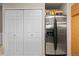 Bright kitchen featuring a stainless steel refrigerator and a pantry for extra storage at 2005 E 103Rd Ave, Thornton, CO 80229
