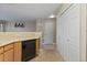This kitchen features stainless steel appliances and wood cabinets, as well as convenient pantry storage at 2005 E 103Rd Ave, Thornton, CO 80229