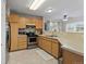 Efficient kitchen design with stainless steel appliances and light wood cabinetry at 2005 E 103Rd Ave, Thornton, CO 80229