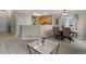 Open-concept living room and dining area with modern flooring and ample natural light at 2005 E 103Rd Ave, Thornton, CO 80229