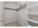 A walk-in closet features built-in shelves for storage and is ready for organization at 2005 E 103Rd Ave, Thornton, CO 80229