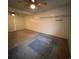 Unfinished basement room with carpet and shelving at 1731 Quail St, Lakewood, CO 80215