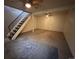 Finished basement area with stairs and carpet at 1731 Quail St, Lakewood, CO 80215