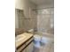 Full bathroom featuring shower over tub and vanity with a cream color counter at 1731 Quail St, Lakewood, CO 80215