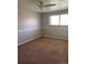 Bedroom with neutral paint, carpet, and window to let the sunshine in at 1731 Quail St, Lakewood, CO 80215