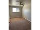 Cozy bedroom with neutral paint, carpet, and window at 1731 Quail St, Lakewood, CO 80215