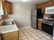 Kitchen with stainless steel appliances and wood cabinets at 1731 Quail St, Lakewood, CO 80215