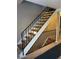 Indoor view of a staircase with simple, black metal railings at 1731 Quail St, Lakewood, CO 80215
