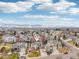 Aerial view of a suburban home nestled in a neighborhood with mountain views in the distance at 6281 Mcintyre Way, Golden, CO 80403