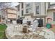 Back patio area with a fire pit and seating, providing a cozy outdoor space at 6281 Mcintyre Way, Golden, CO 80403