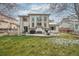 A lovely patio area is set up for outdoor relaxation and dining in the home's lush backyard space at 6281 Mcintyre Way, Golden, CO 80403