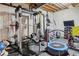 Basement workout room with a variety of exercise equipment and black floor mats at 6281 Mcintyre Way, Golden, CO 80403