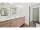 Spacious bathroom with double sinks, stylish wood cabinetry, and a modern design at 6281 Mcintyre Way, Golden, CO 80403