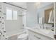 Modern bathroom features a tiled shower/tub combination and a sleek vanity at 6281 Mcintyre Way, Golden, CO 80403