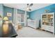 Charming blue bedroom with plush carpet, ceiling fan, and plenty of natural light at 6281 Mcintyre Way, Golden, CO 80403