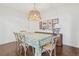 Bright dining room featuring a large table, patterned table cloth, and rustic chandelier at 6281 Mcintyre Way, Golden, CO 80403