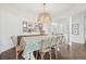 Inviting dining room with stylish chandelier, hardwood floors, and ample natural light at 6281 Mcintyre Way, Golden, CO 80403