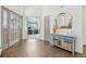 Bright foyer with hardwood floors, stylish console table, and view into office at 6281 Mcintyre Way, Golden, CO 80403