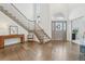 Elegant foyer with hardwood floors, staircase, and high ceilings for a grand entrance at 6281 Mcintyre Way, Golden, CO 80403