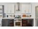 Modern kitchen with white cabinets, stainless steel appliances, and a large island at 6281 Mcintyre Way, Golden, CO 80403