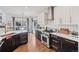 Stylish kitchen with white and dark wood cabinets, quartz countertops, and stainless steel appliances at 6281 Mcintyre Way, Golden, CO 80403